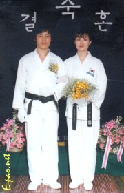 Master Chang Seng Dong, 7th Dan Black Belt and International Master, with his wife in the traditional Taekwondo attire on their wedding day