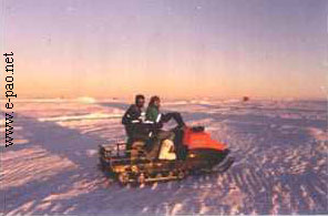 gajananda and
      his friend on a snow-mobile